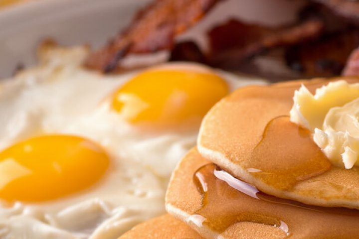 breakfast food: eggs, pancakes, bacon